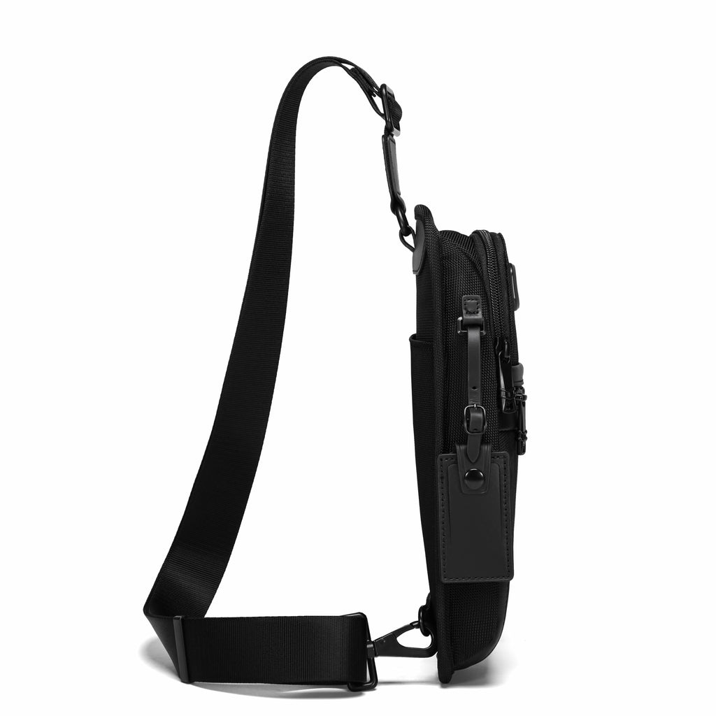 A black tactical sling bag shown from a side profile view, featuring a wide adjustable shoulder strap and multiple zippered compartments, set against a plain white background.