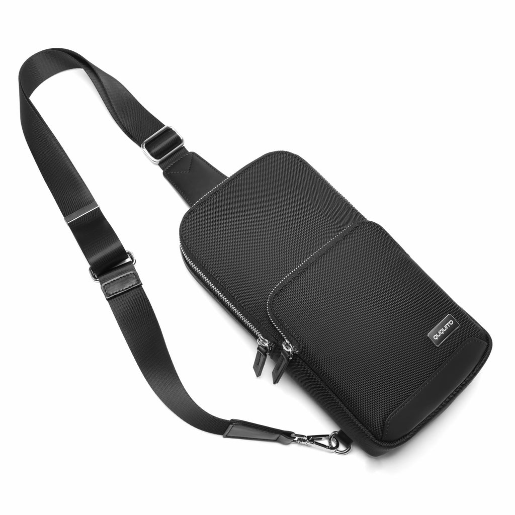 A black nylon crossbody bag with an adjustable shoulder strap, shown from a three-quarters perspective on a clean white background.