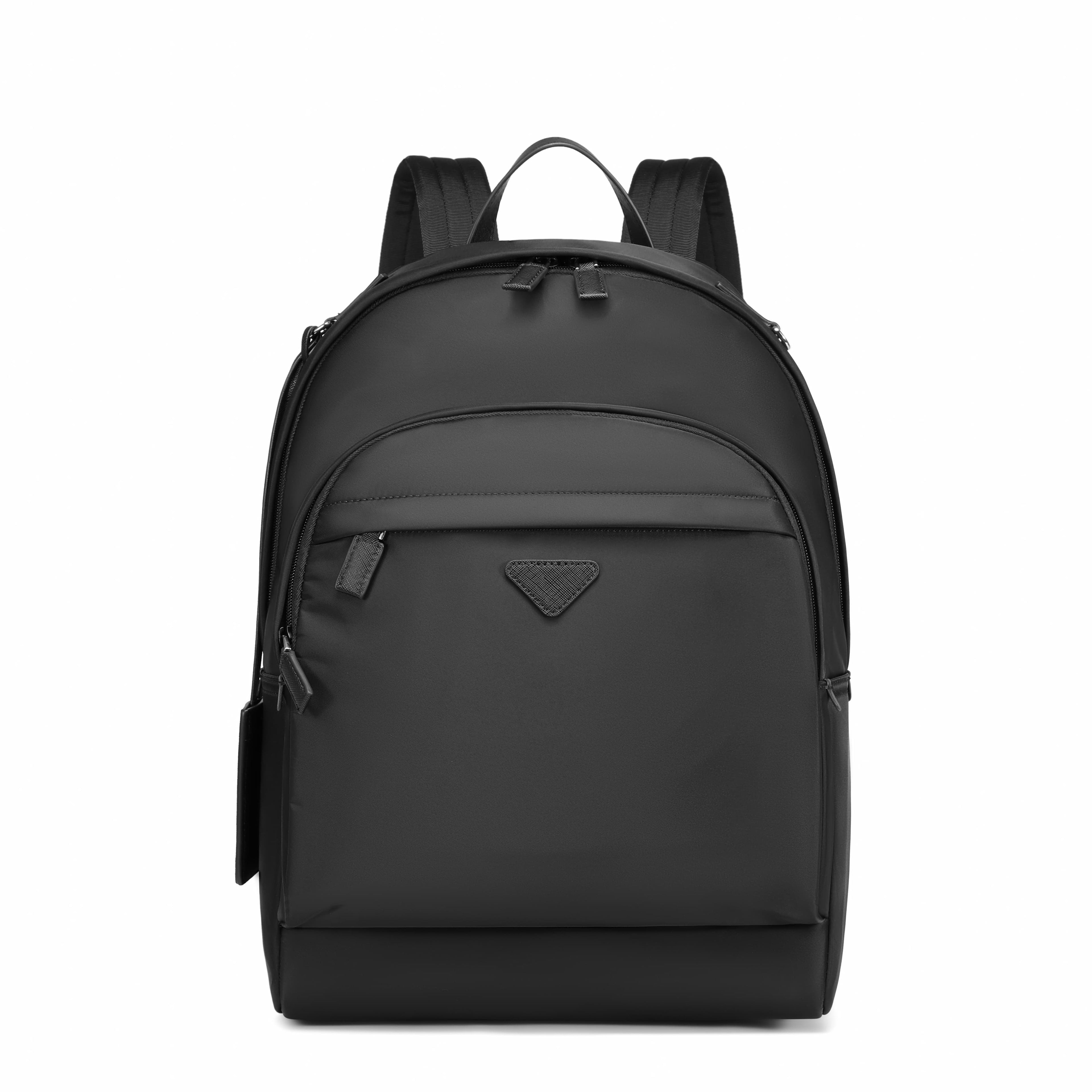 A black nylon backpack with a top handle, dual shoulder straps, a front zippered pocket, and a small triangular logo plaque on the front, shown against a plain white background.