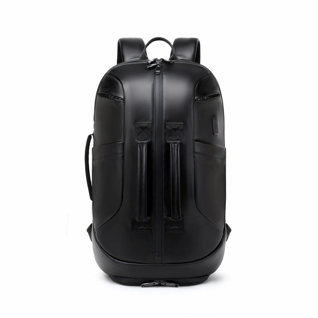 A black leather backpack with dual vertical front zipper compartments, shown from the back on a solid white background.