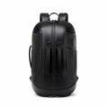 A black leather backpack with dual vertical front zipper compartments, shown from the back on a solid white background.