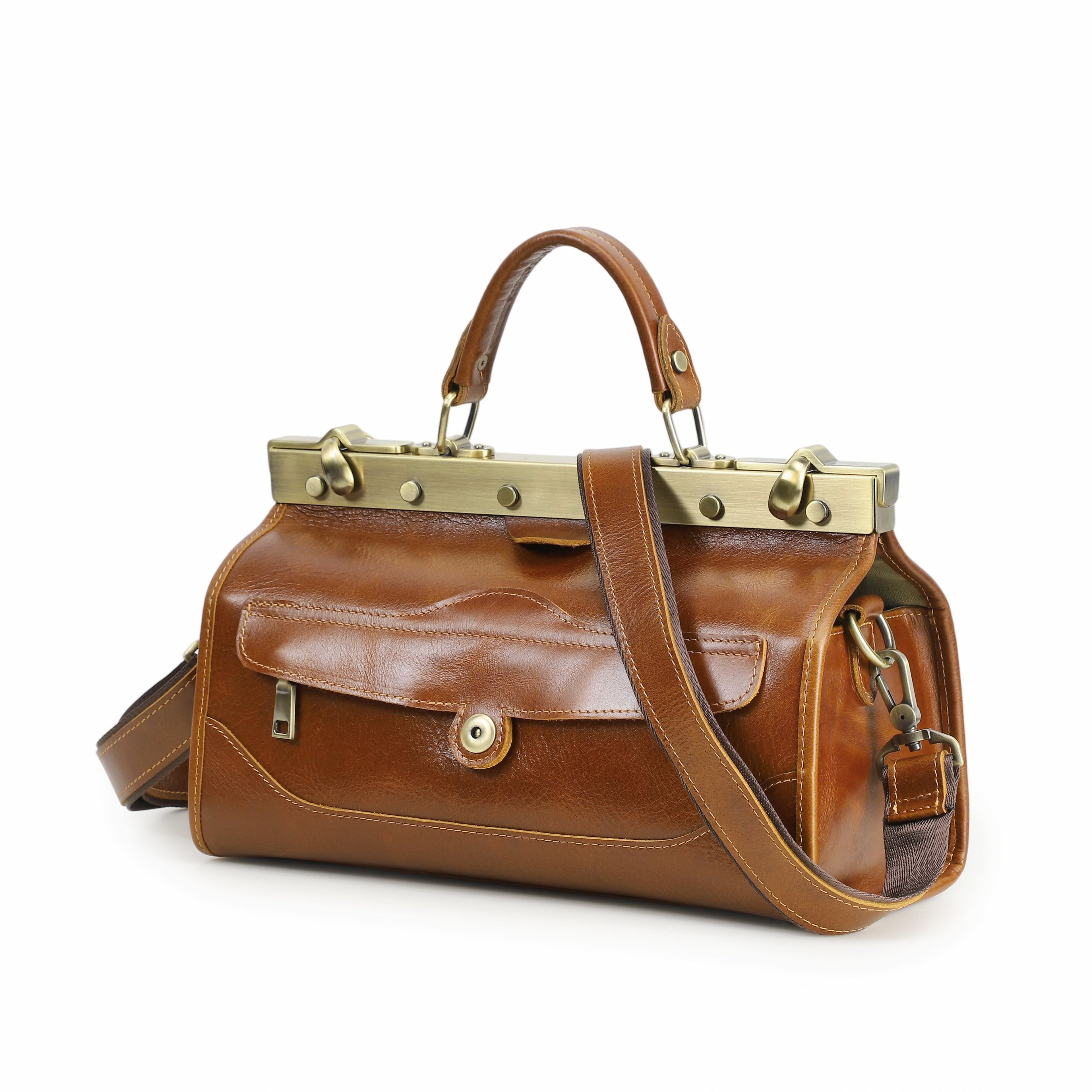 Brown leather handbag with gold accents on a white background