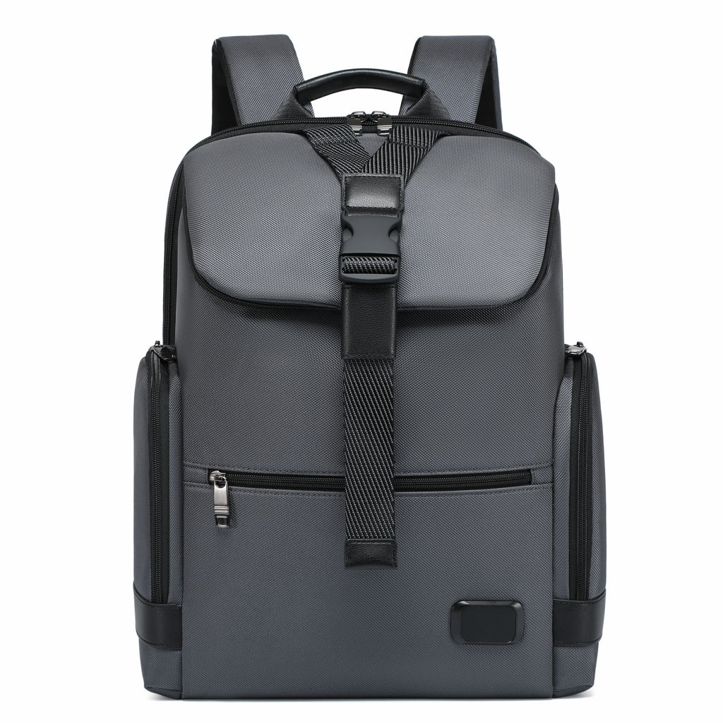 A dark gray and black backpack with a front flap pocket, vertical compression strap, and side pockets, shown against a plain white background.