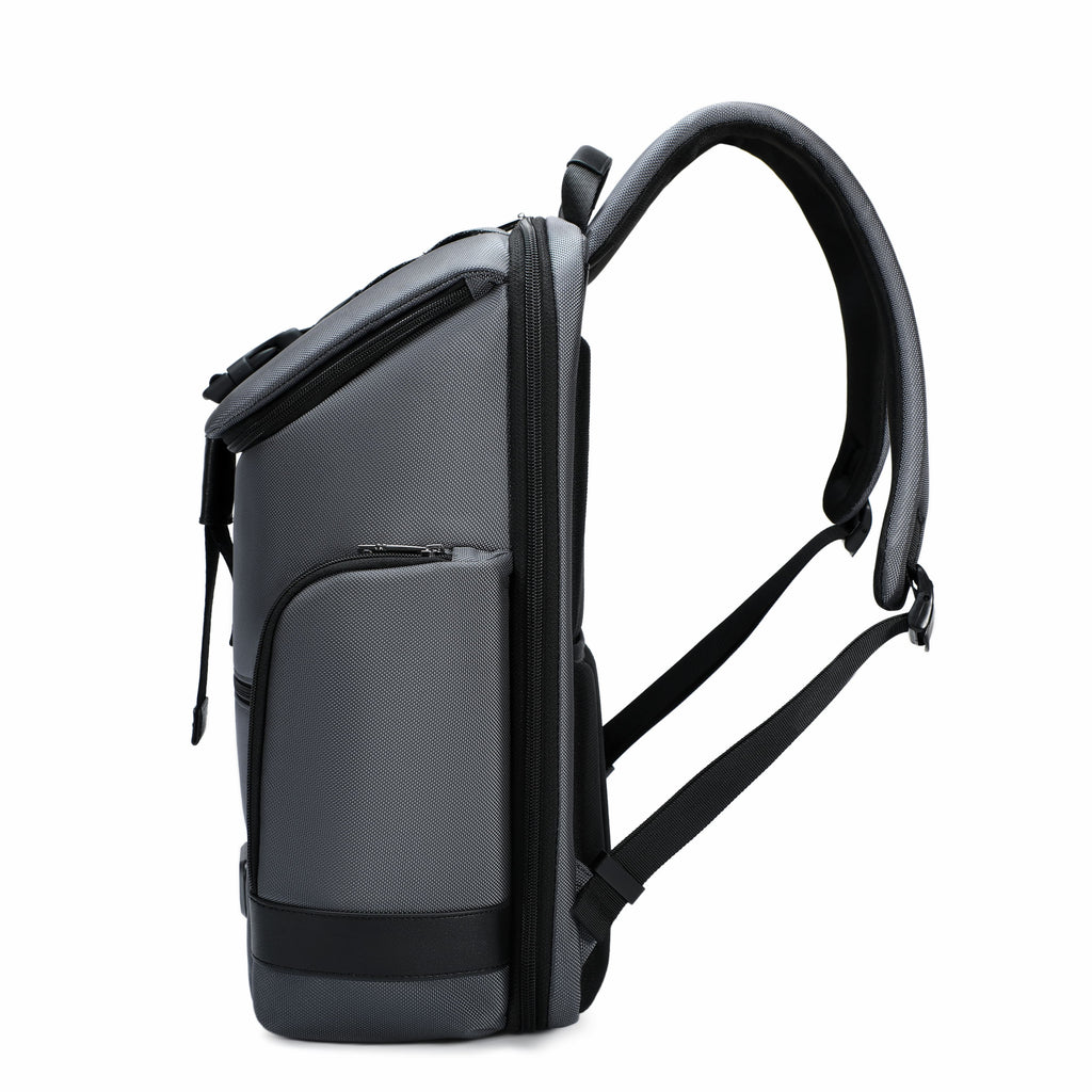 A dark gray and black backpack shown from a side profile view against a solid white background.