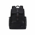 A black nylon backpack with brown leather accents and a central buckle strap, shown from the back on a solid white background.