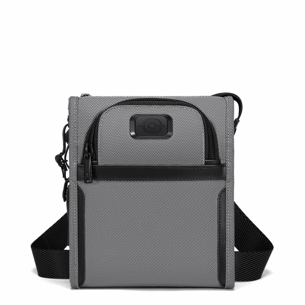 A gray and black crossbody tablet bag with a textured fabric body, black zippers, and an adjustable black shoulder strap, shown against a plain white background.