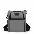 A gray and black crossbody tablet bag with a textured fabric body, black zippers, and an adjustable black shoulder strap, shown against a plain white background.