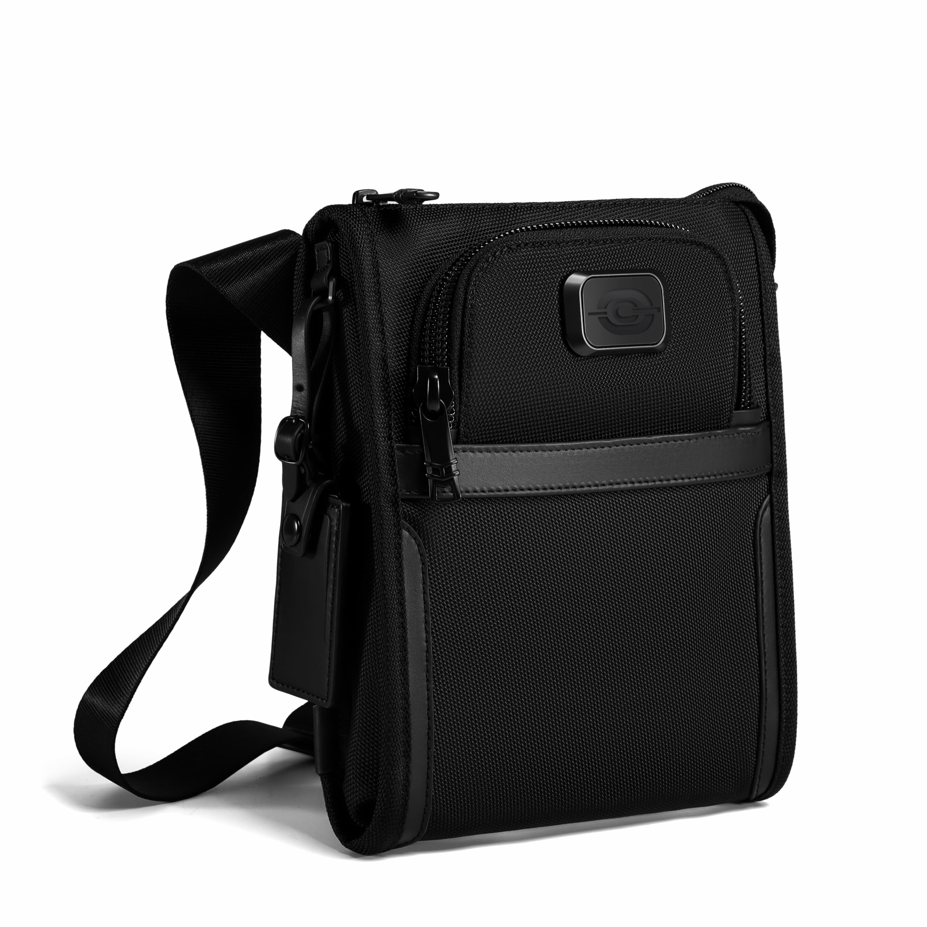 A black men's crossbody laptop bag with a front zippered pocket, a horizontal black leather accent stripe, and a small square logo plaque on the front, shown on a white background.