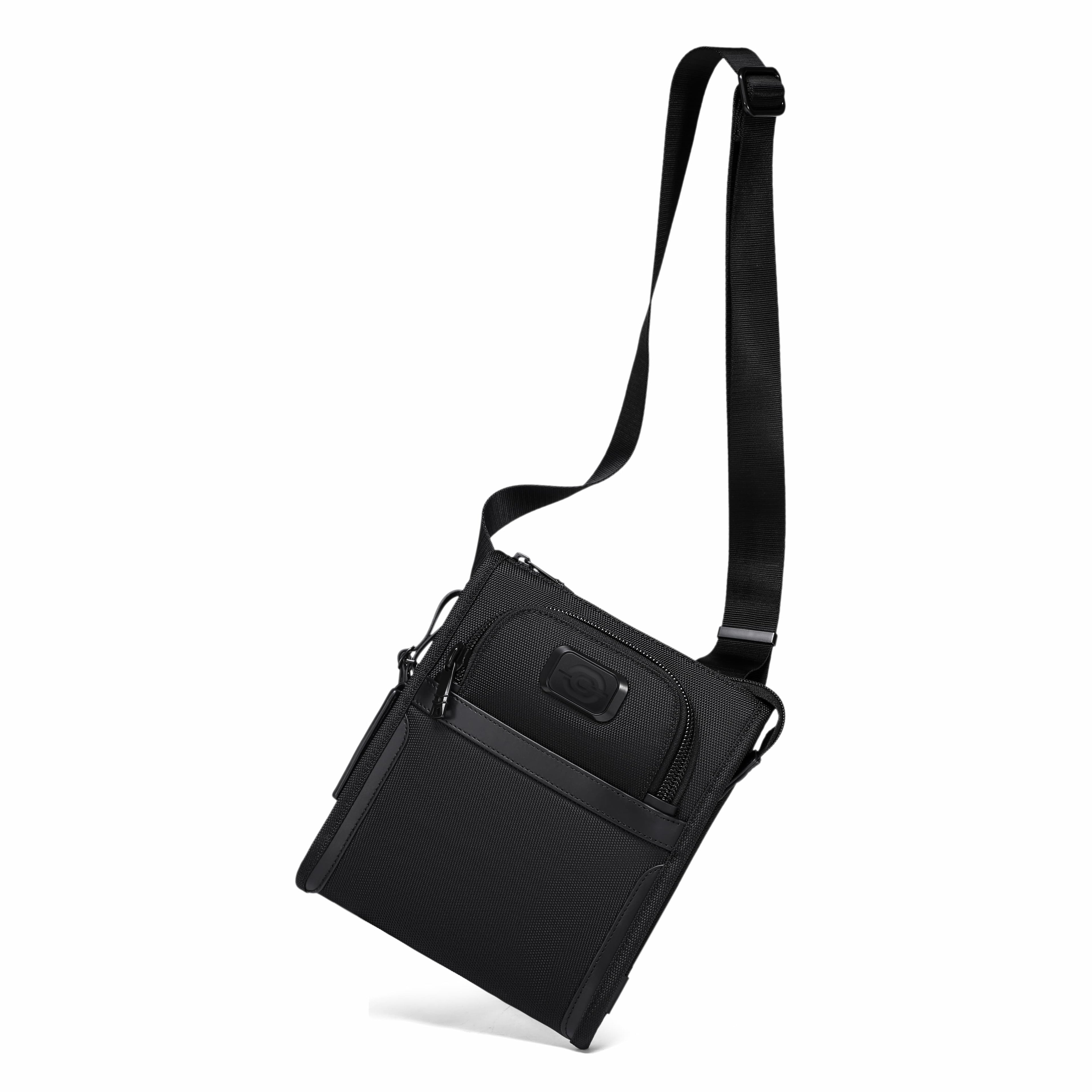A black nylon crossbody bag with a long adjustable shoulder strap, shown at an angle on a solid white background.
