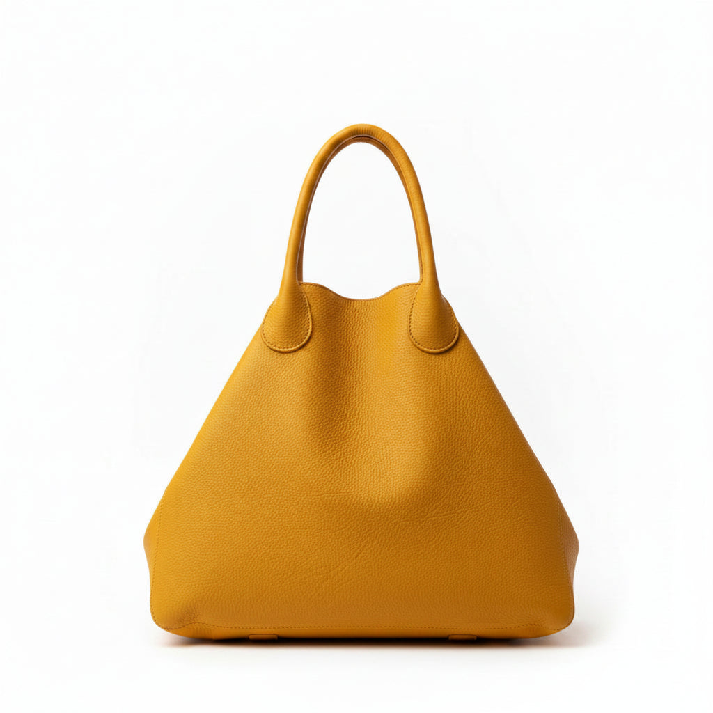  large, textured mustard yellow leather tote bag with double top handles.