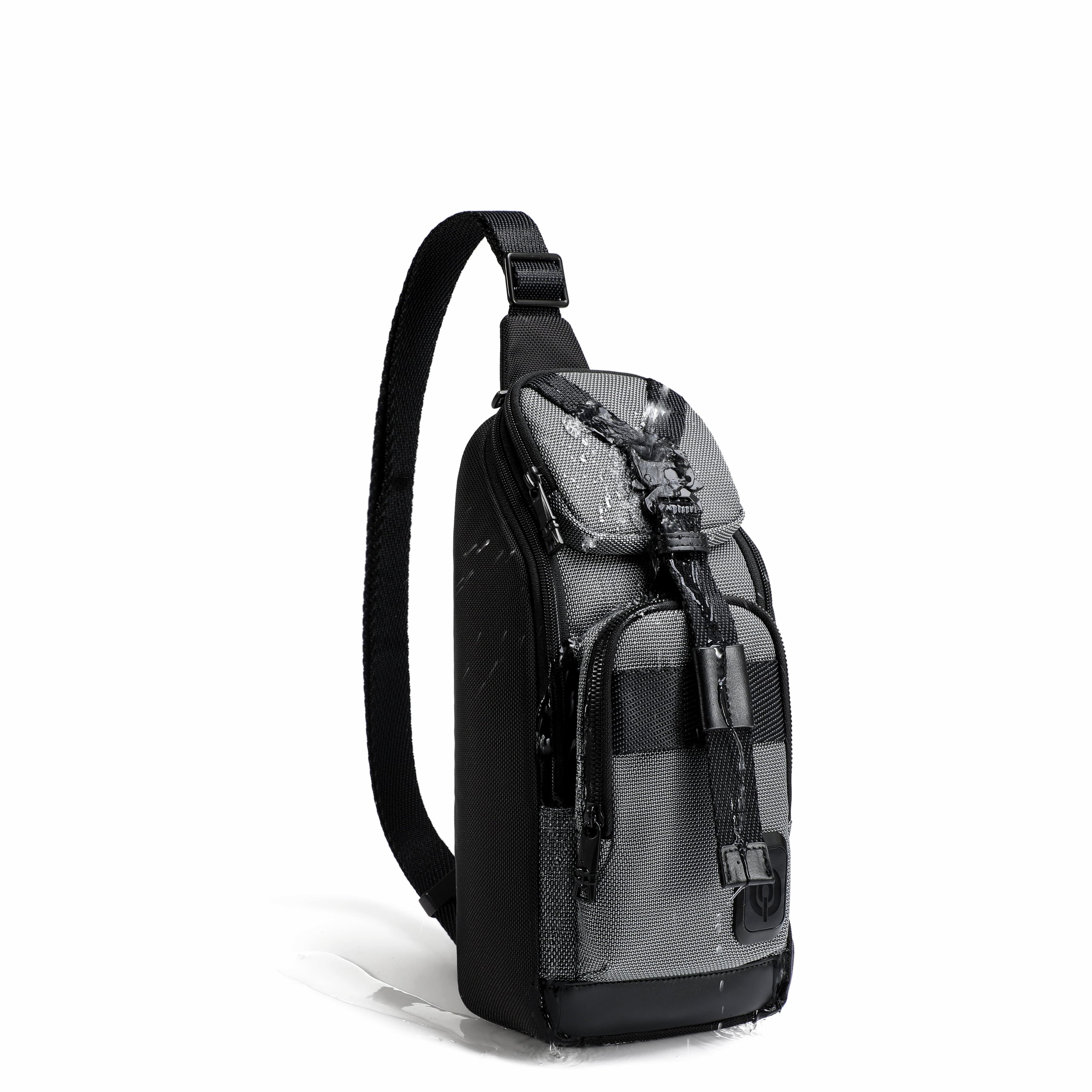 A black and gray sling backpack with a single shoulder strap, shown from a three-quarter angle on a white background.