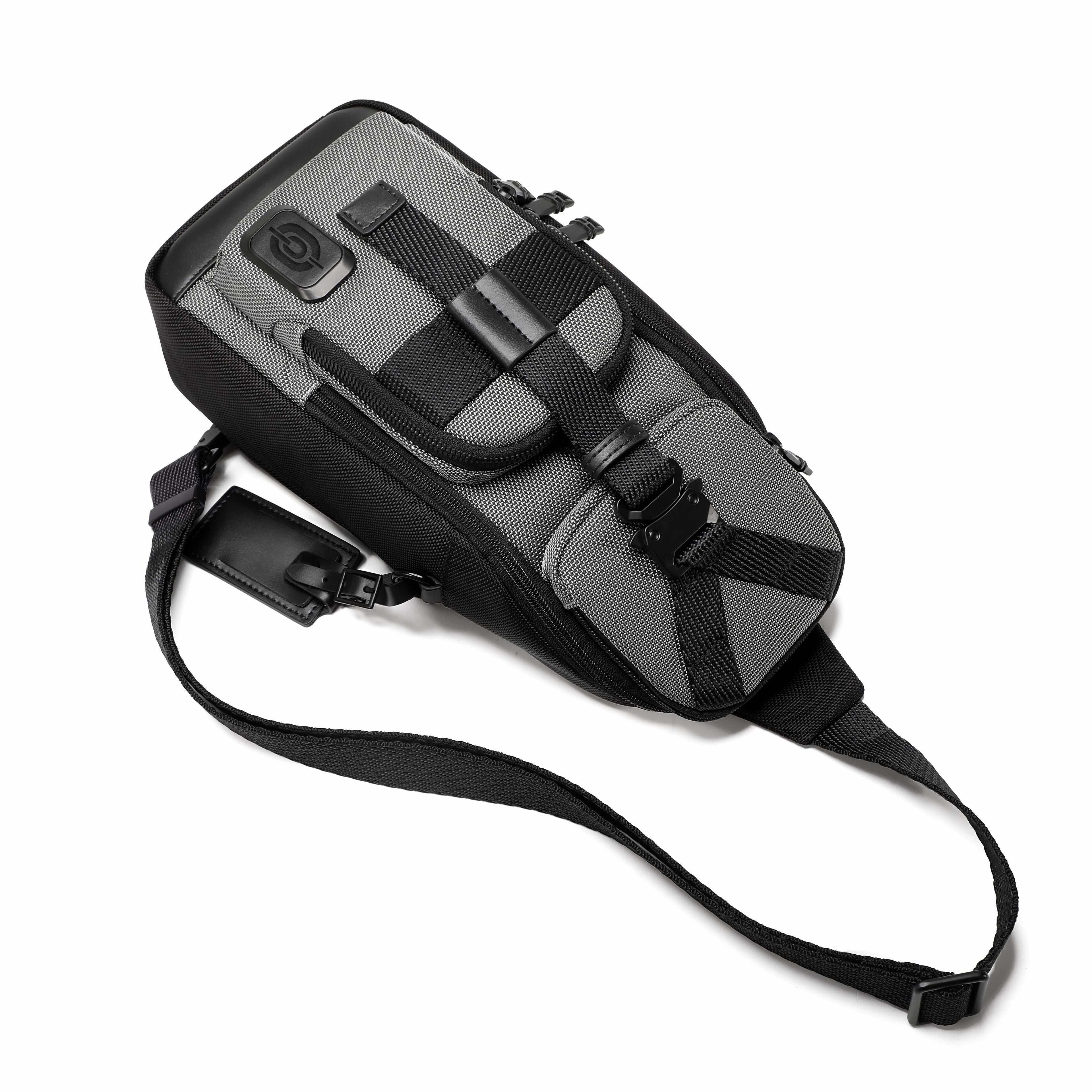 A gray and black bicycle saddle bag with an adjustable black shoulder strap, shown on a plain white background.