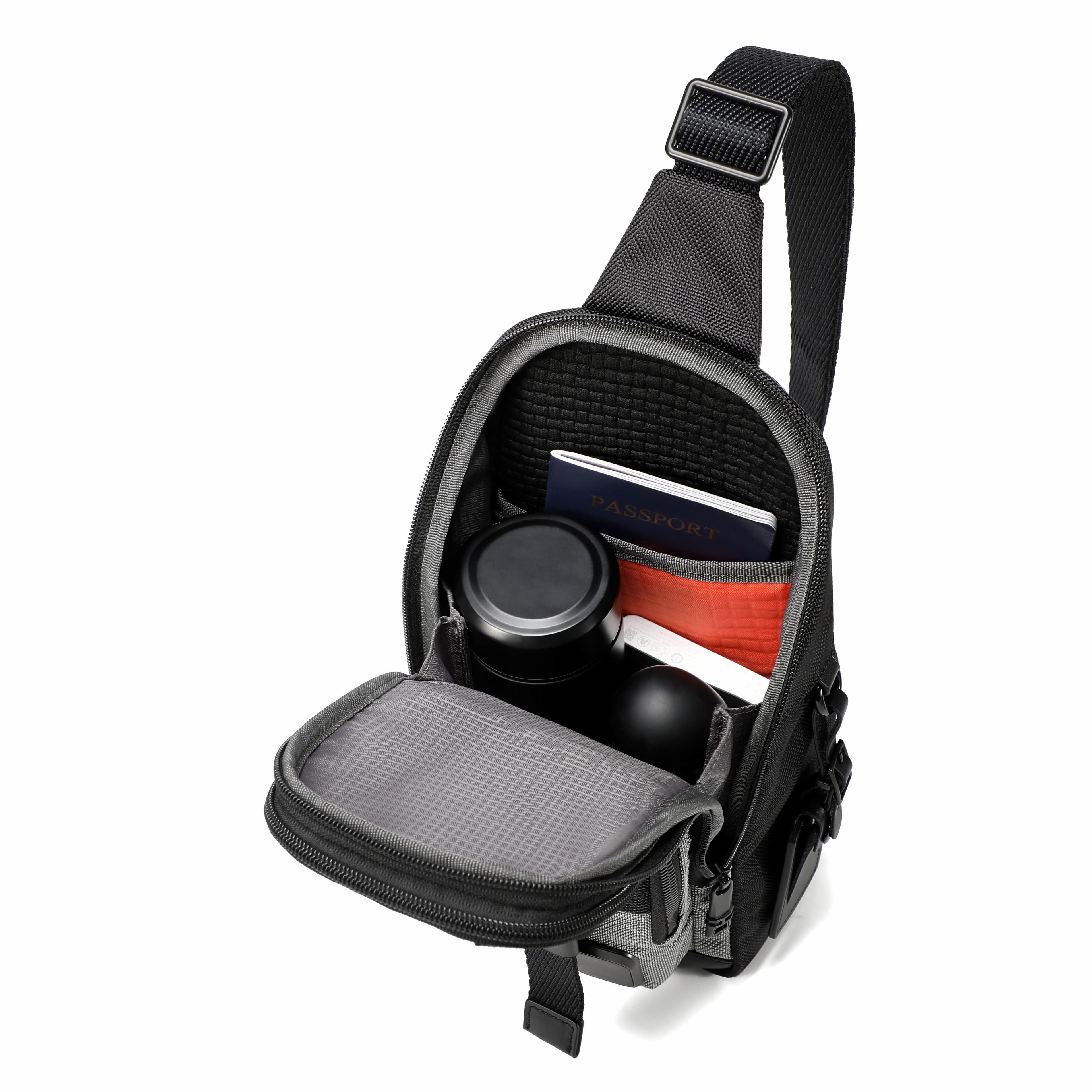 A black sling camera bag shown open on a white background, displaying its interior compartments, mesh pockets, and organizer slots containing camera accessories.