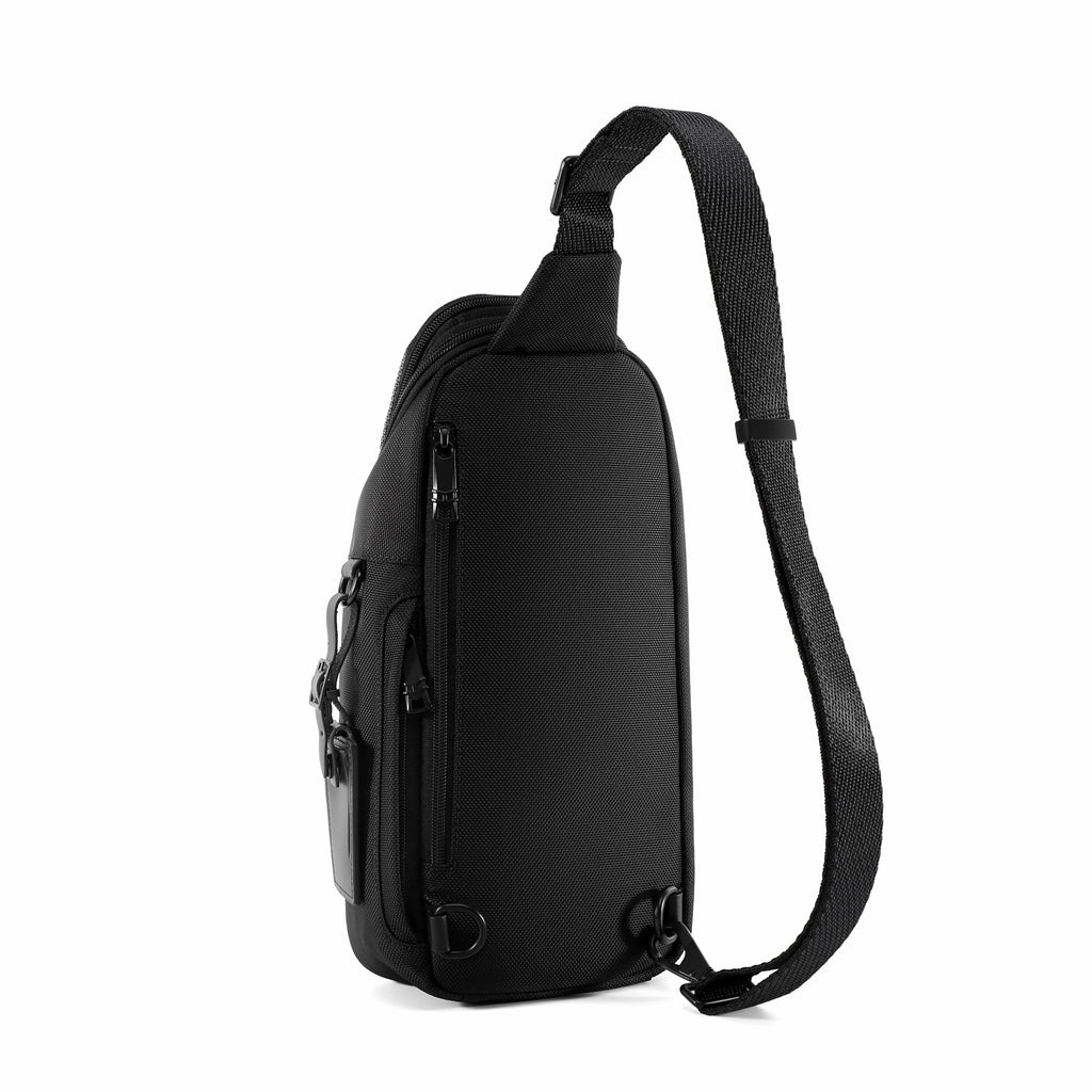 A black textured sling bag with a single adjustable shoulder strap, shown from a side profile view against a solid white background.