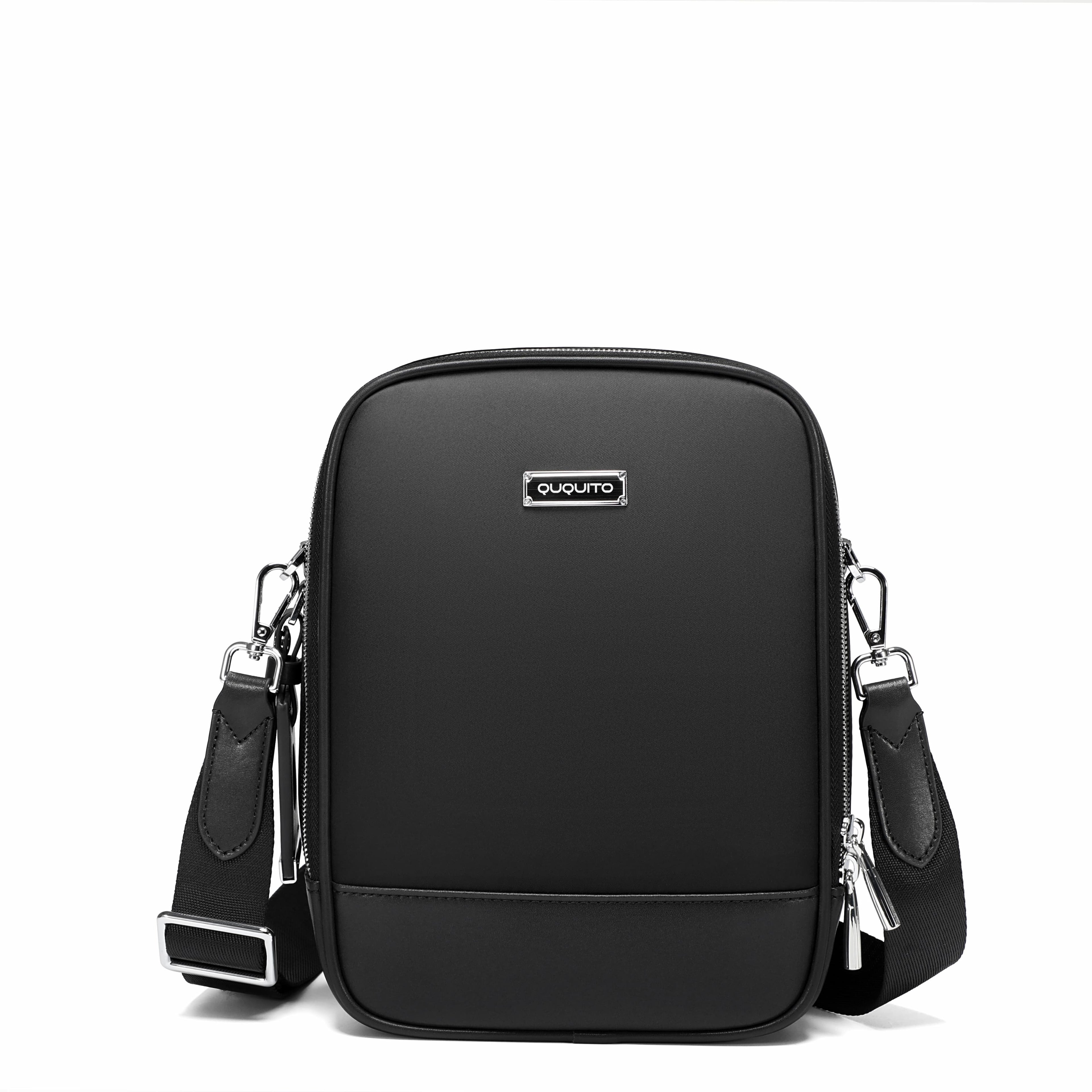 A black nylon crossbody bag with a silver-tone metal logo plate on the front, shown on a clean white background.