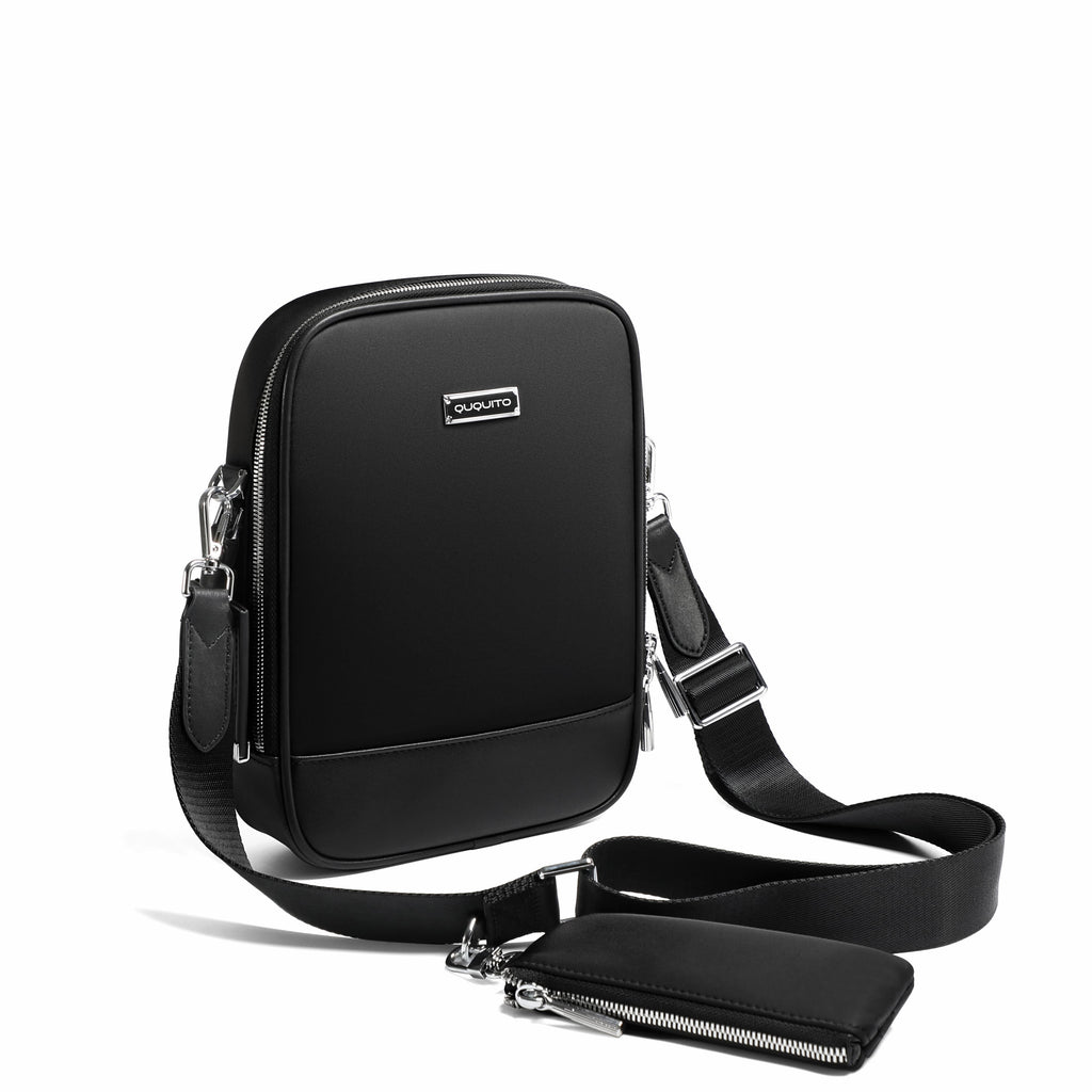 A black rectangular crossbody phone bag with a matching zippered pouch and adjustable shoulder strap, displayed on a clean white background.