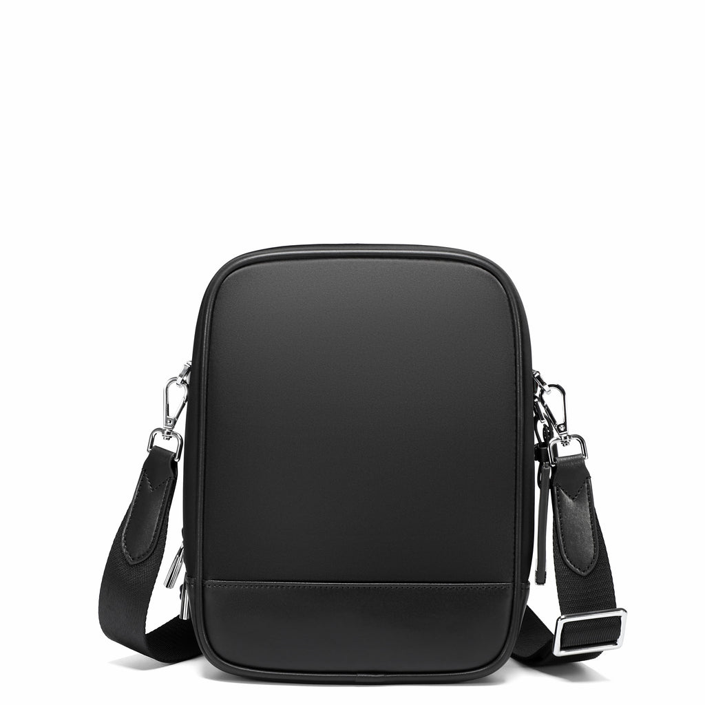 A black rectangular crossbody bag with a matching adjustable shoulder strap and silver-tone hardware, photographed against a solid white background.
