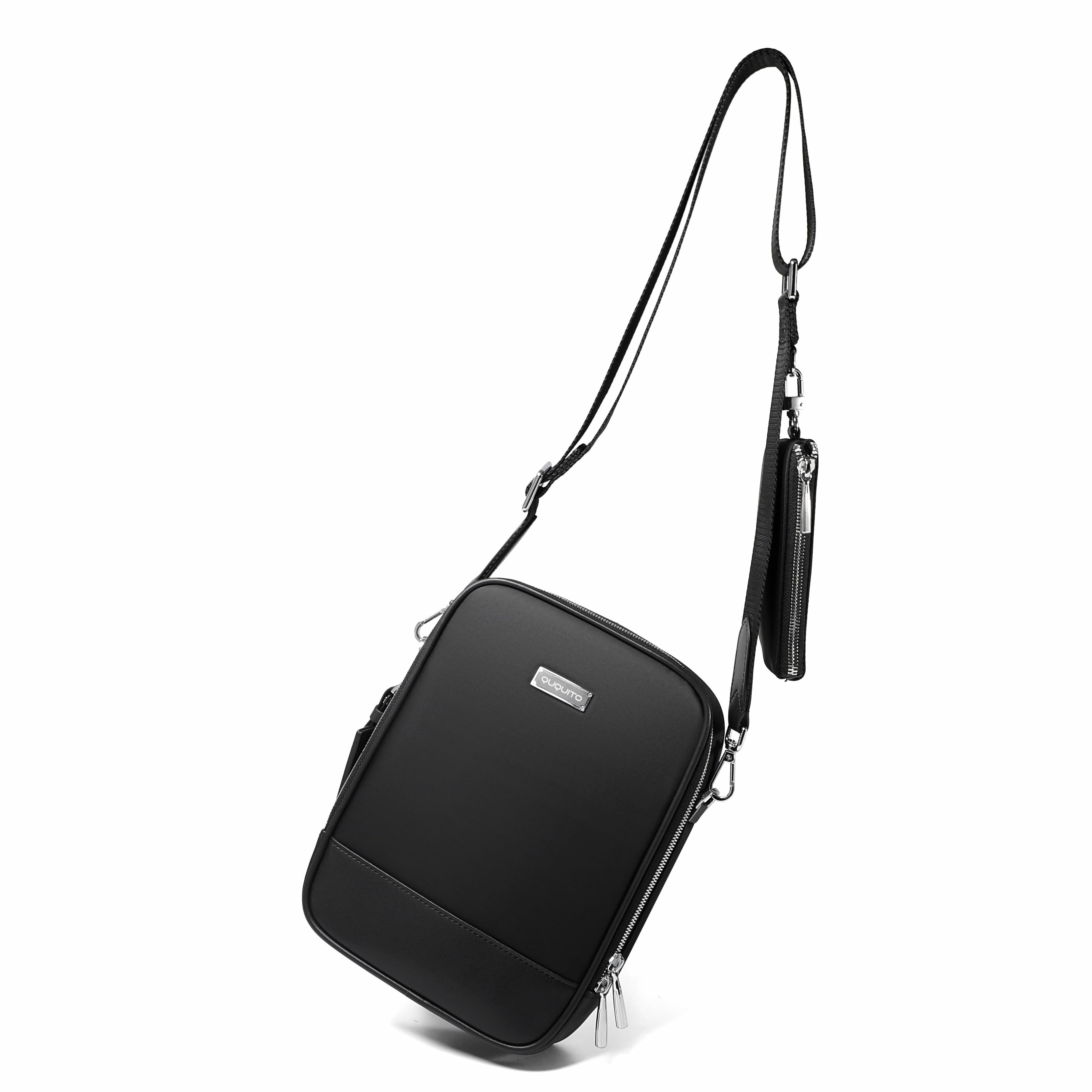 A black crossbody bag with a slim shoulder strap and a small attached pouch, shown on a clean white background.