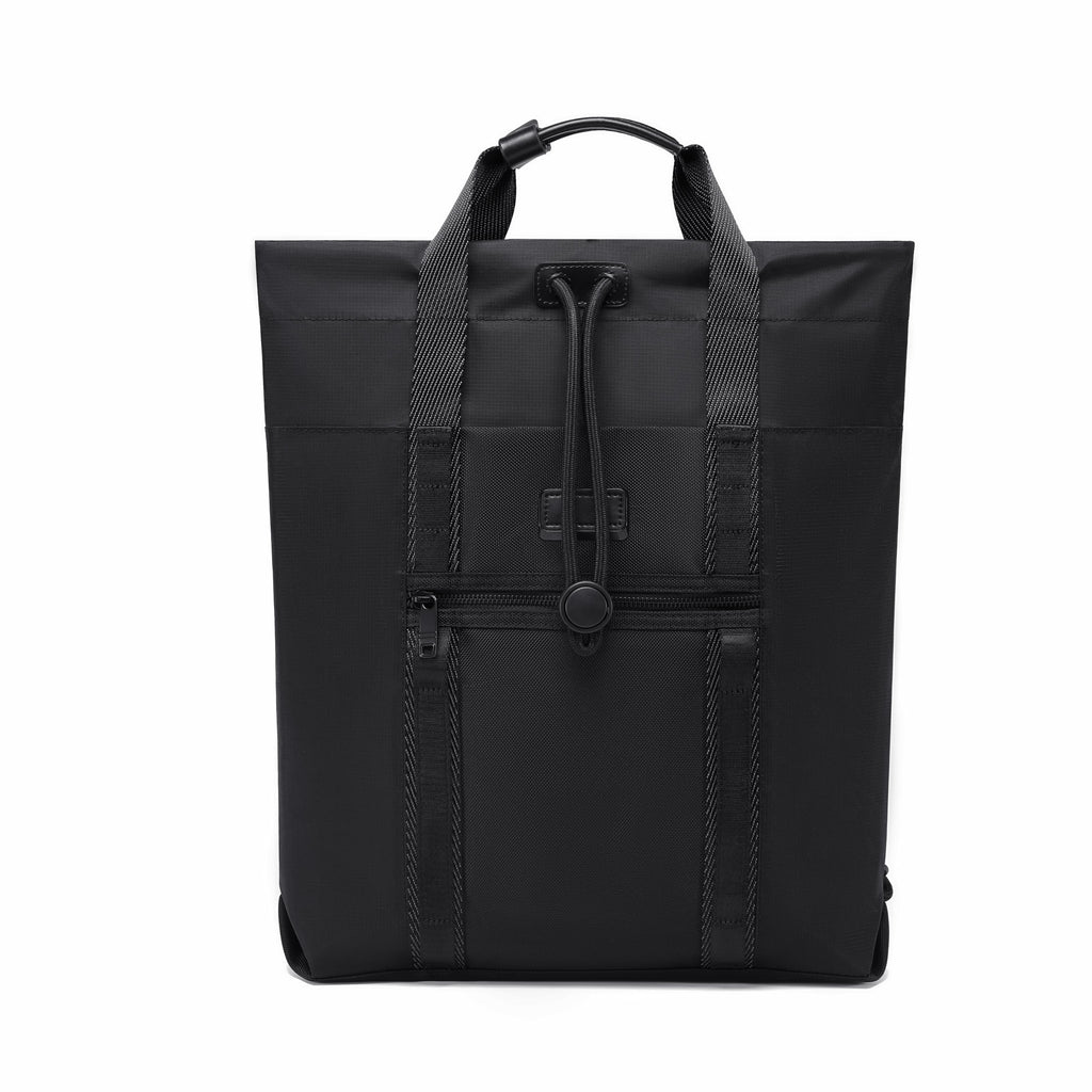 A black nylon tote bag with dual top handles, a drawstring closure, and front zippered pockets, shown against a plain white background.